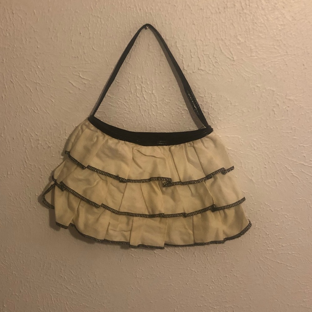 Off-white with black trim ruffle tote.